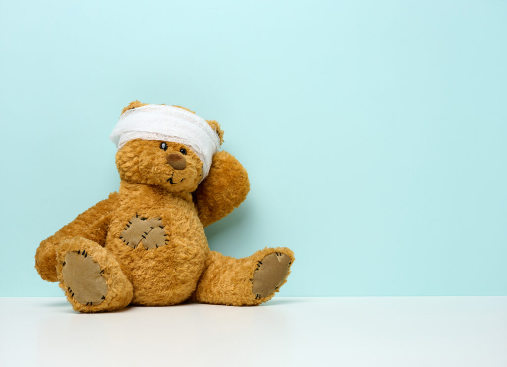 children s toy teddy bear sits with a bandaged hea 2023 11 27 05 08 23 utc scaled